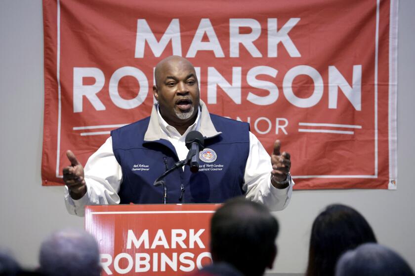 FILE - North Carolina Lt. Gov. Mark Robinson, a Republican candidate for North Carolina governor, speaks at a rally Friday, Jan. 26, 2024, in Roxboro, N.C. In his bid to become North Carolina's first Black governor, Robinson assails government safety-net spending as a "plantation of welfare and victimhood" that he says has mired generations of Black people in "dependency" and poverty. But the firebrand lieutenant governor's political rise wouldn't have been possible without it. (AP Photo/Chris Seward, File)