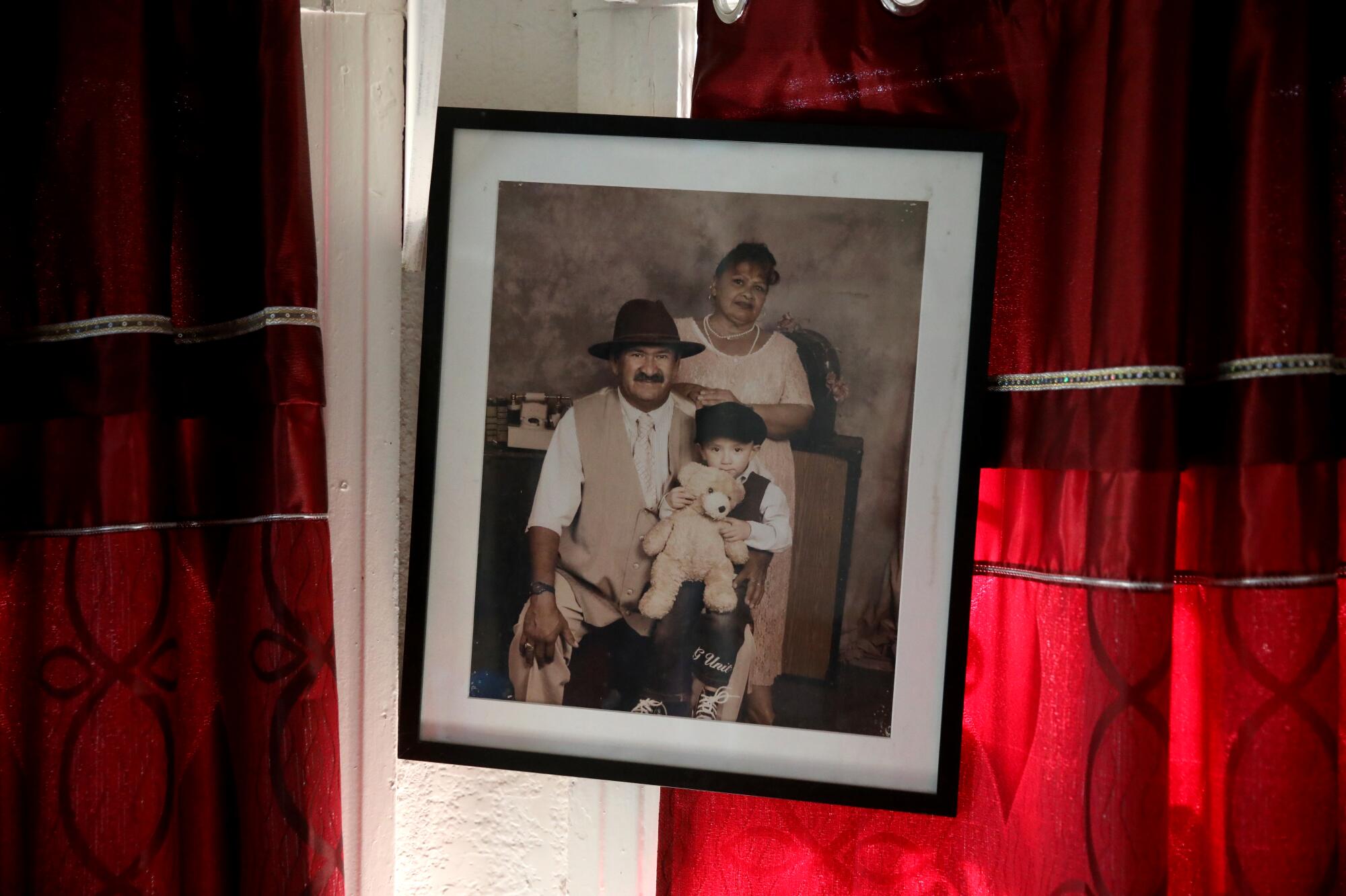 A portrait of Vicky Escalante, husband Yelman Oviedo and grandson Brian Oviedo. 
