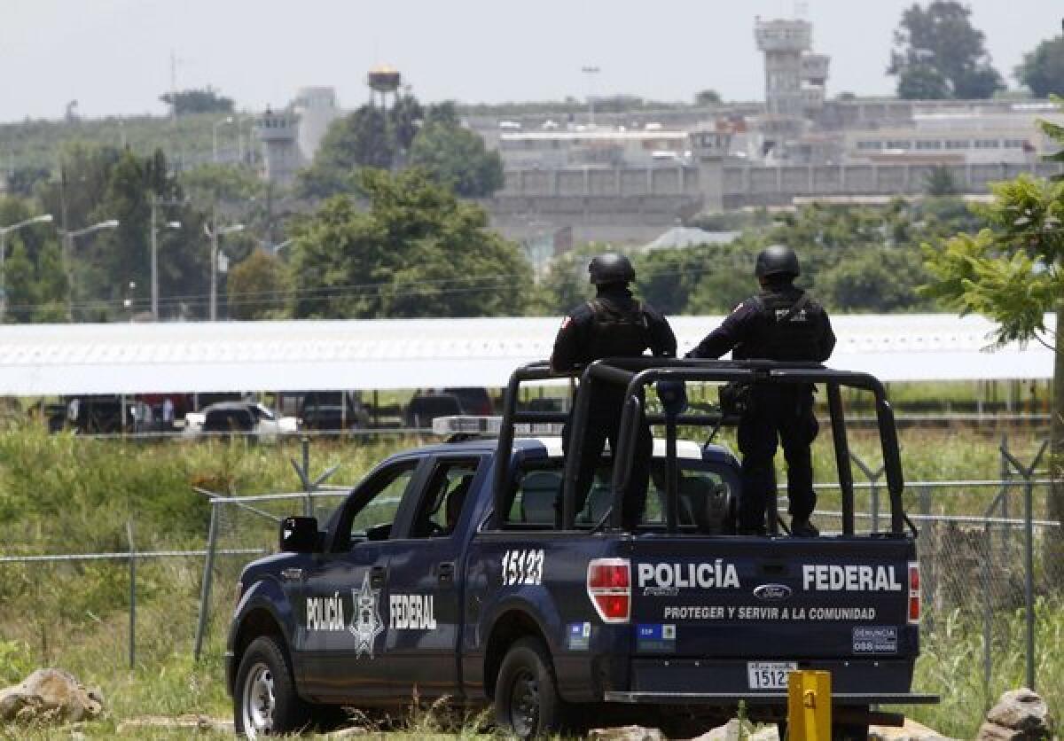 A Mexican Federal Police vehicle patrols near Puente Grande state prison in Zapotlanejo, Jalisco state, Mexico, where former top cartel boss Rafael Caro Quintero was released after serving 28 years for the kidnapping and murder of a U.S. anti-drug agent.