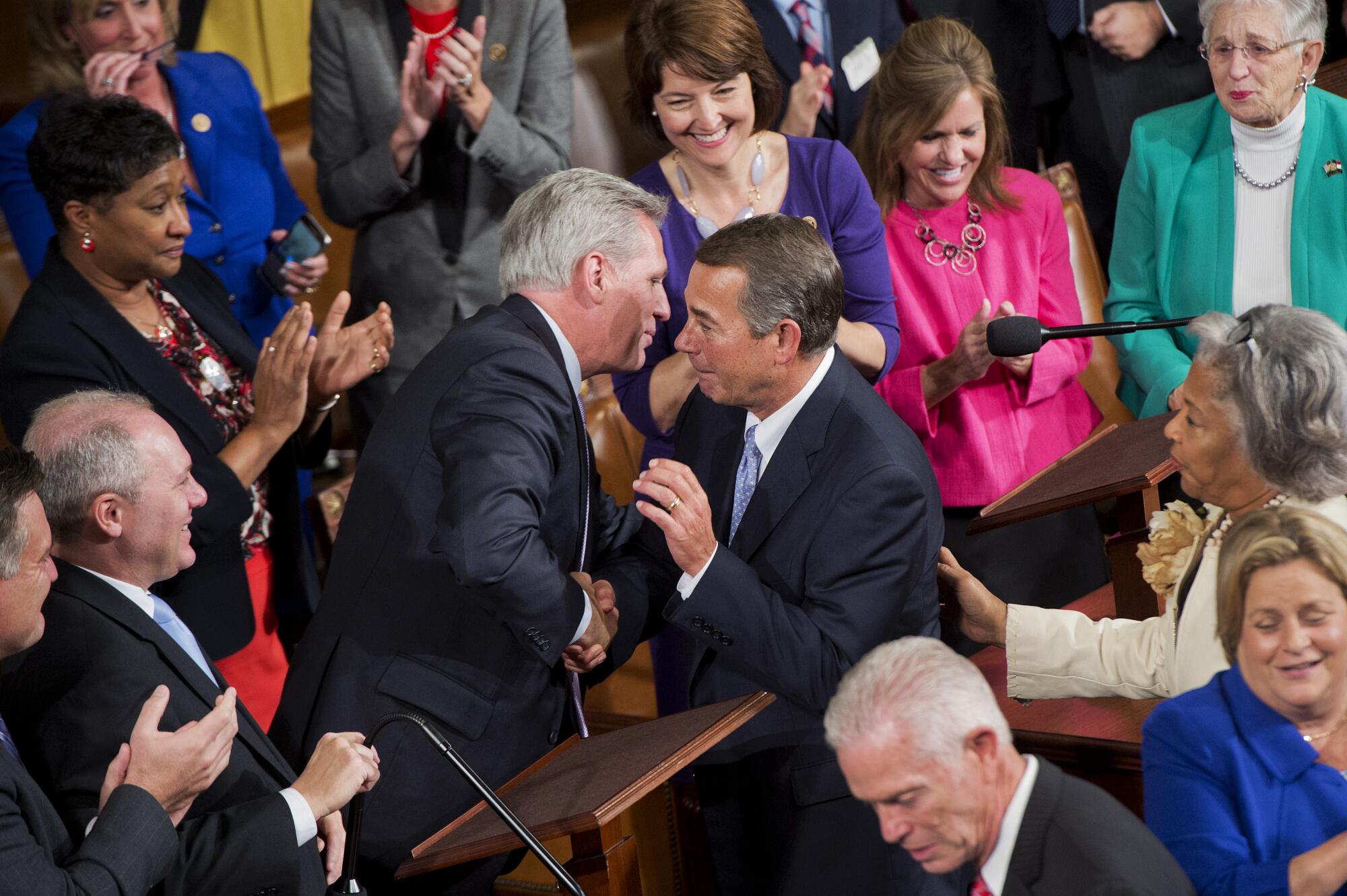 Two men greet each other.