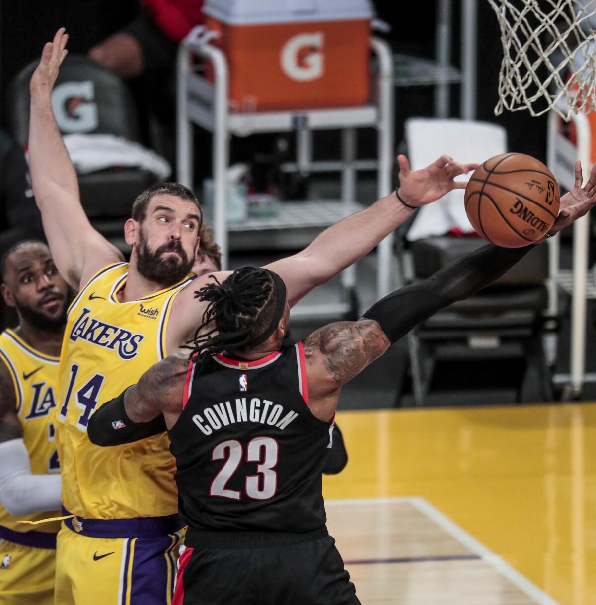 Lakers center Marc Gasol blocks a layup by Trail Blazers forward Robert Covington.