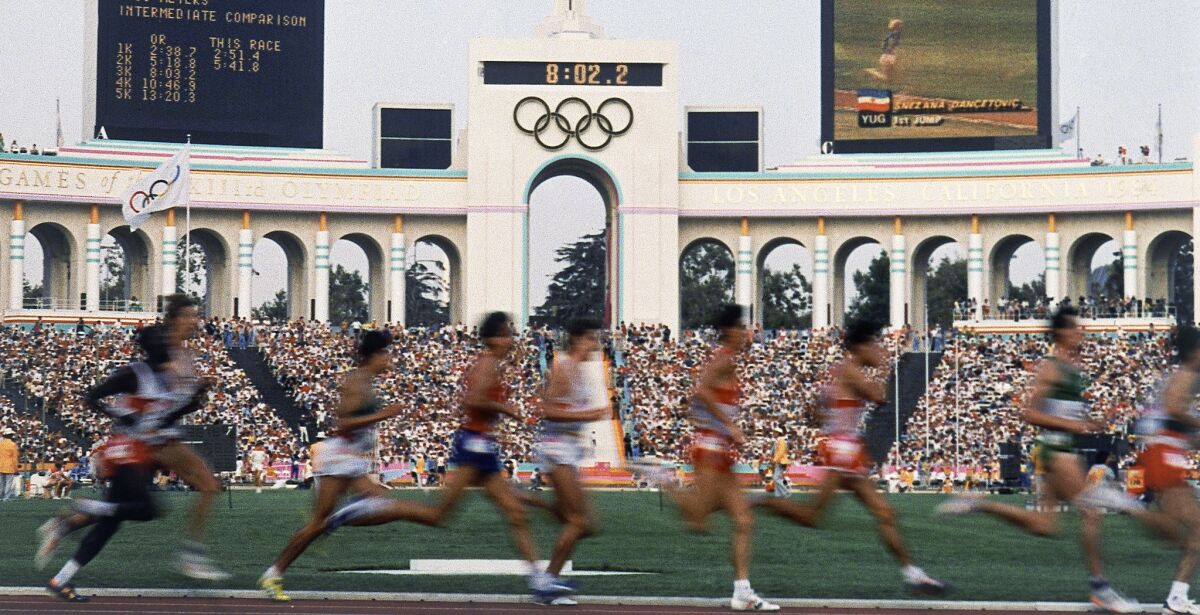 Runners compete at the Coliseum during the 1984 Olympics