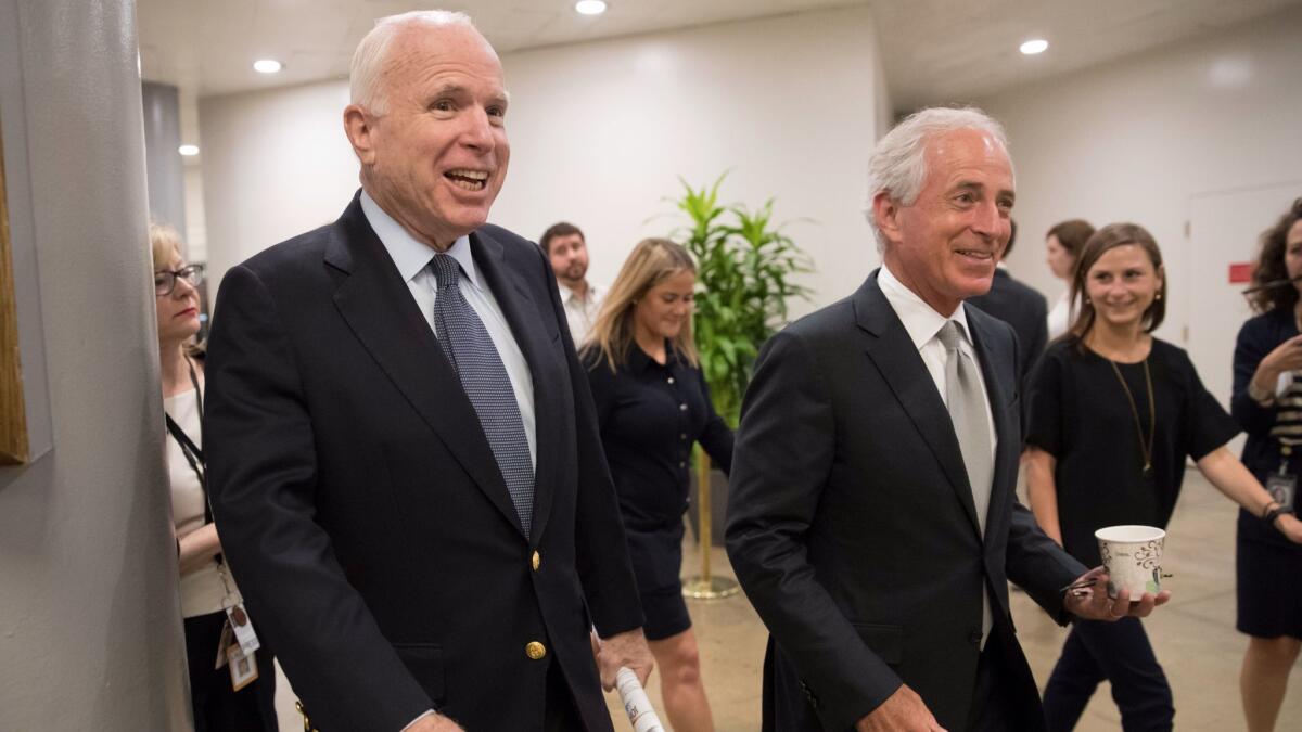 Sen. John McCain, R-Ariz. and Sen. Bob Corker, R-Tenn. head to the Senate for a meeting in Washington on July 13.