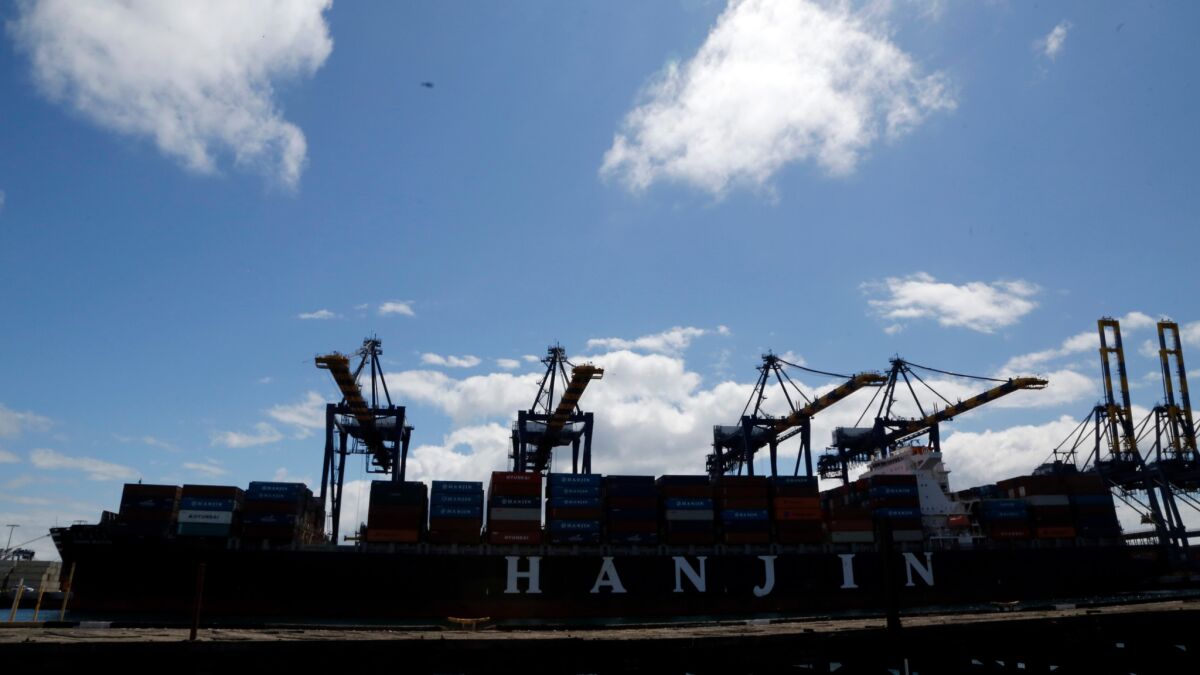 The container ship Hanjin Boston is unloaded at the Port of Los Angeles on Tuesday, before being returned to its owner, according to a company executive.