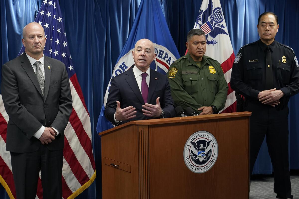 Homeland Security Secretary Alejandro Mayorkas, second from left, speaks during a news conference in Washington, Thursday, Jan. 5, 2023, on new border enforcement measures to limit unlawful migration, expand pathways for legal immigration, and increase border security. Mayorkas is joined by, from left, Customs and Border Protection Acting Commissioner Troy Miller, U.S. Border Patrol Chief Raul Ortiz and Southwest Border Coordination Center (SBCC) Senior Coordinating Official Sidney Aki. (AP Photo/Susan Walsh)