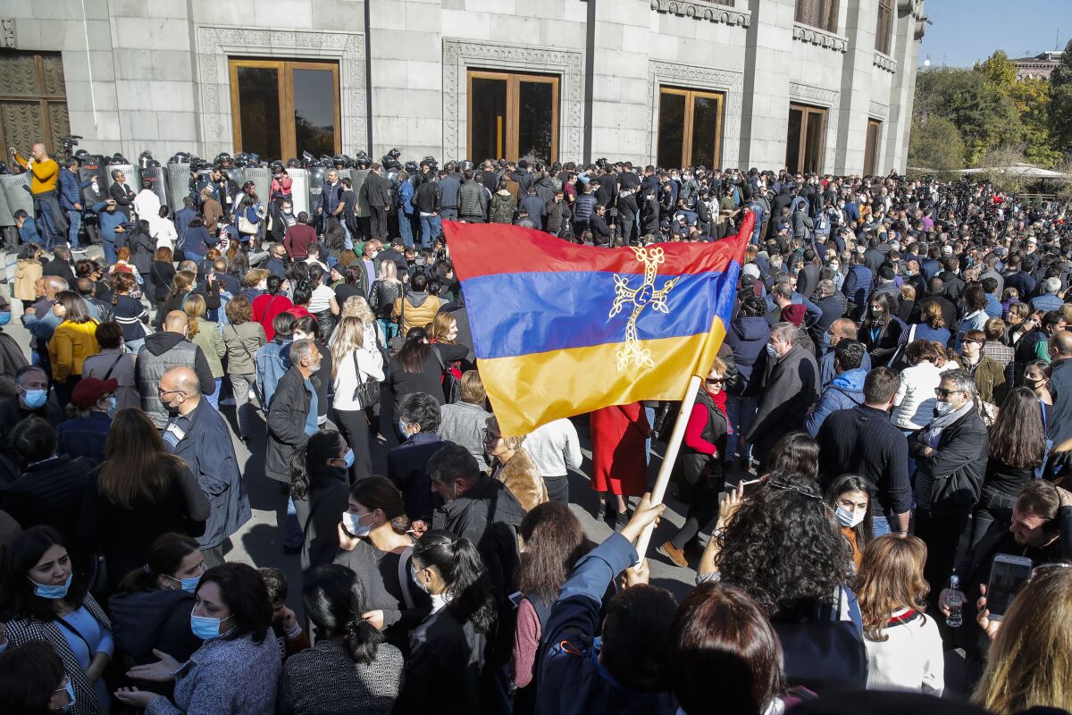 Protesters wave an Armenian national flag in Yerevan, Armenia, on Wednesday.