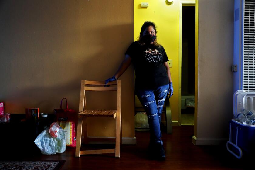 LOS ANGELES, CA - JUNE 17: Claudia Mendez, 42, was living in her apartment and quarantining because she had the coronavirus, the landlord locked her out and removed her belonging, on Wednesday, June 17, 2020 in Los Angeles, CA. Potential illegal evictions during the coronavirus pandemic which have been concentrated, per the data in South LA neighborhoods. (Gary Coronado / Los Angeles Times)