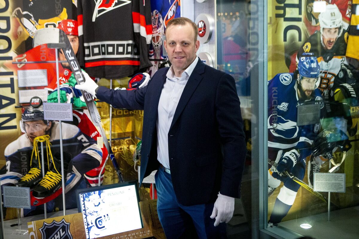Emergency backup goaltender David Ayres with his goalie stick at the Hockey Hall of Fame in Toronto.