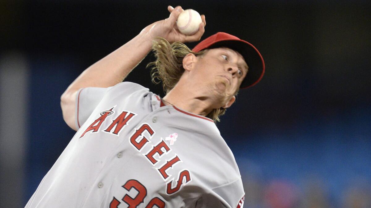 Angels starter Jered Weaver delivers a pitch during the first inning of the team's 9-3 win over the Toronto Blue Jays on Sunday.