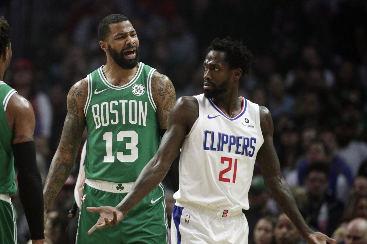 Patrick Beverley and Celtics forward Marcus Morris trade words during a March 11 game.