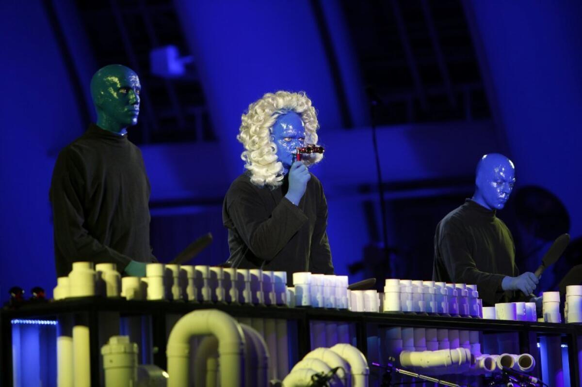 The members of Blue Man Group play a percussion instrument made out of PVC pipe as they rehearse for their first performance at the Hollywood Bowl.