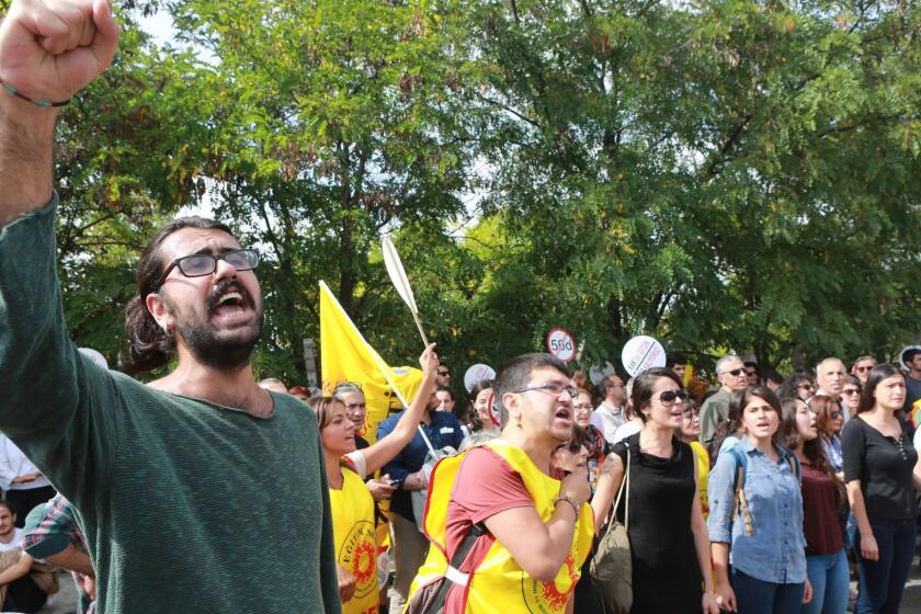 Demonstrators shout during a protest against the suspension of academics from universities following a post-coup emergency decree in Ankara