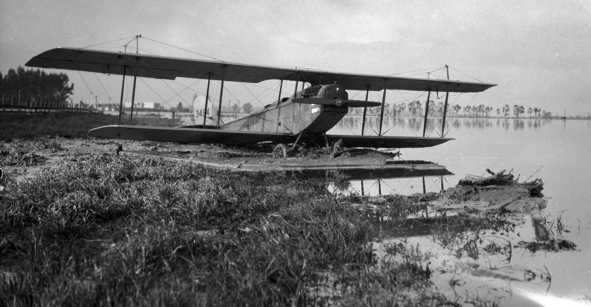 March 1928: A Curtiss JN-4 "Jenny" biplane that was swept away by the flood resulting from the failure of the St. Francis Dam.