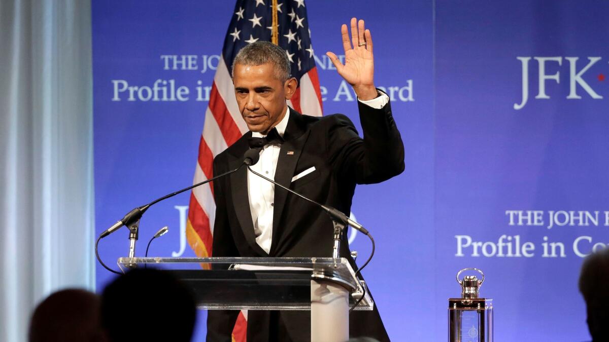 Former President Barack Obama accepts the Profile in Courage Award at the John F. Kennedy Presidential Library and Museum on May 7 in Boston.