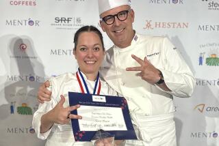 Stefanie De Palma celebrates her win at the Bocuse d'Or candidate competition with William Bradley of Addison. 