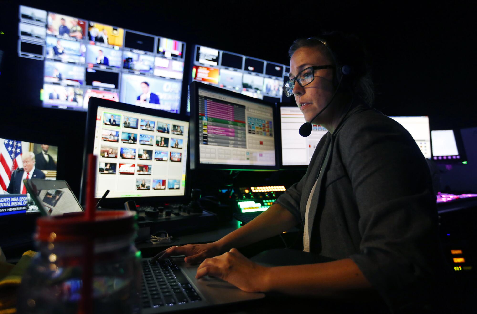 Julie Dell directs an evening news segment at the San Diego-based One America News on Sept. 5, 2019.