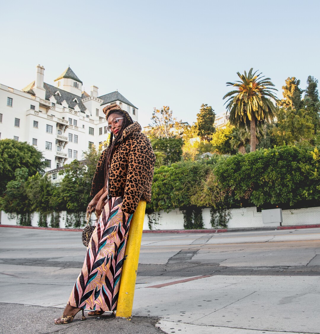 A photo of Autumn Adeigbo outside Pinches Tacos in West Hollywood.