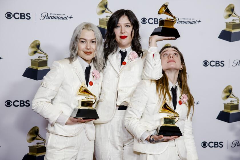 Boygenius, with trophy, at the 66th Grammy Awards