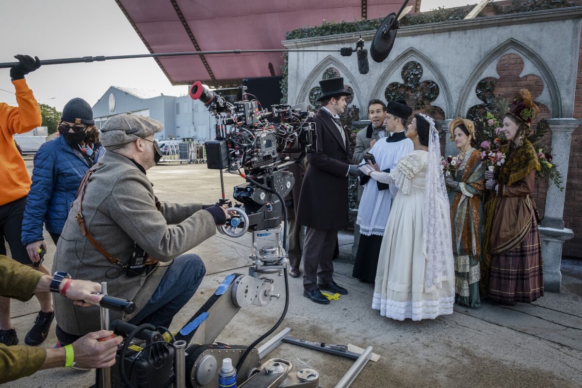 People in victorian dress shot on a set getting married