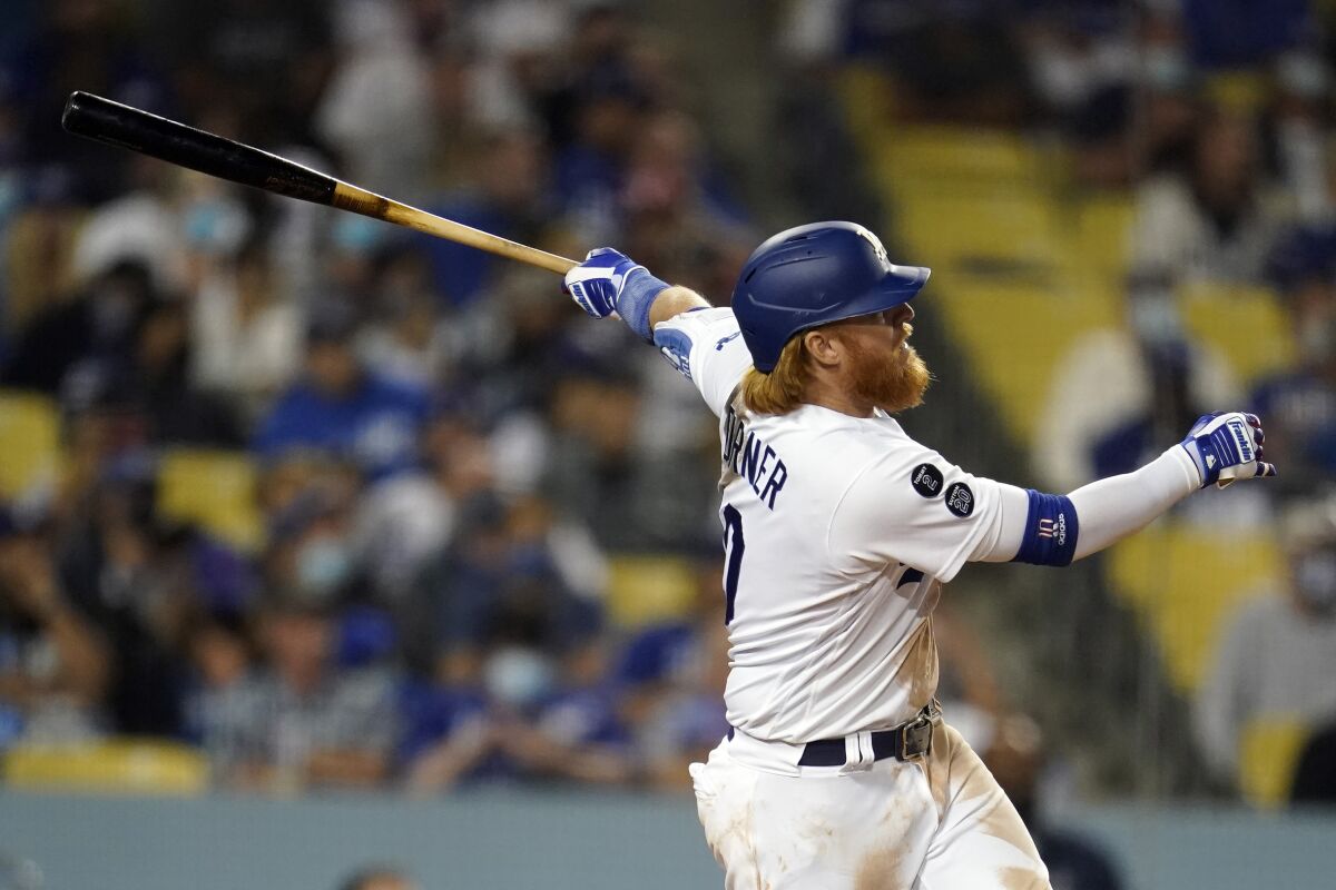 Justin Turner follows through on his solo home run during the seventh inning.