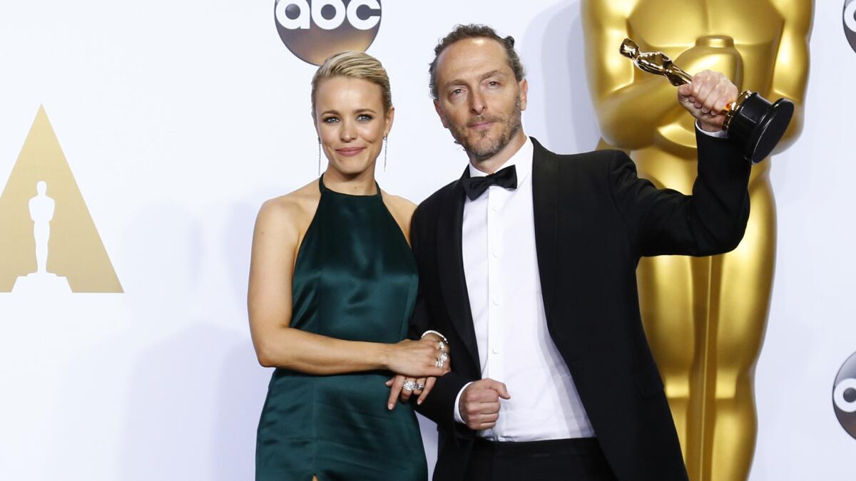 "The Revenant" cinematographer Emmanuel Lubezki, with Rachel McAdams backstage at the 88th Academy Awards.
