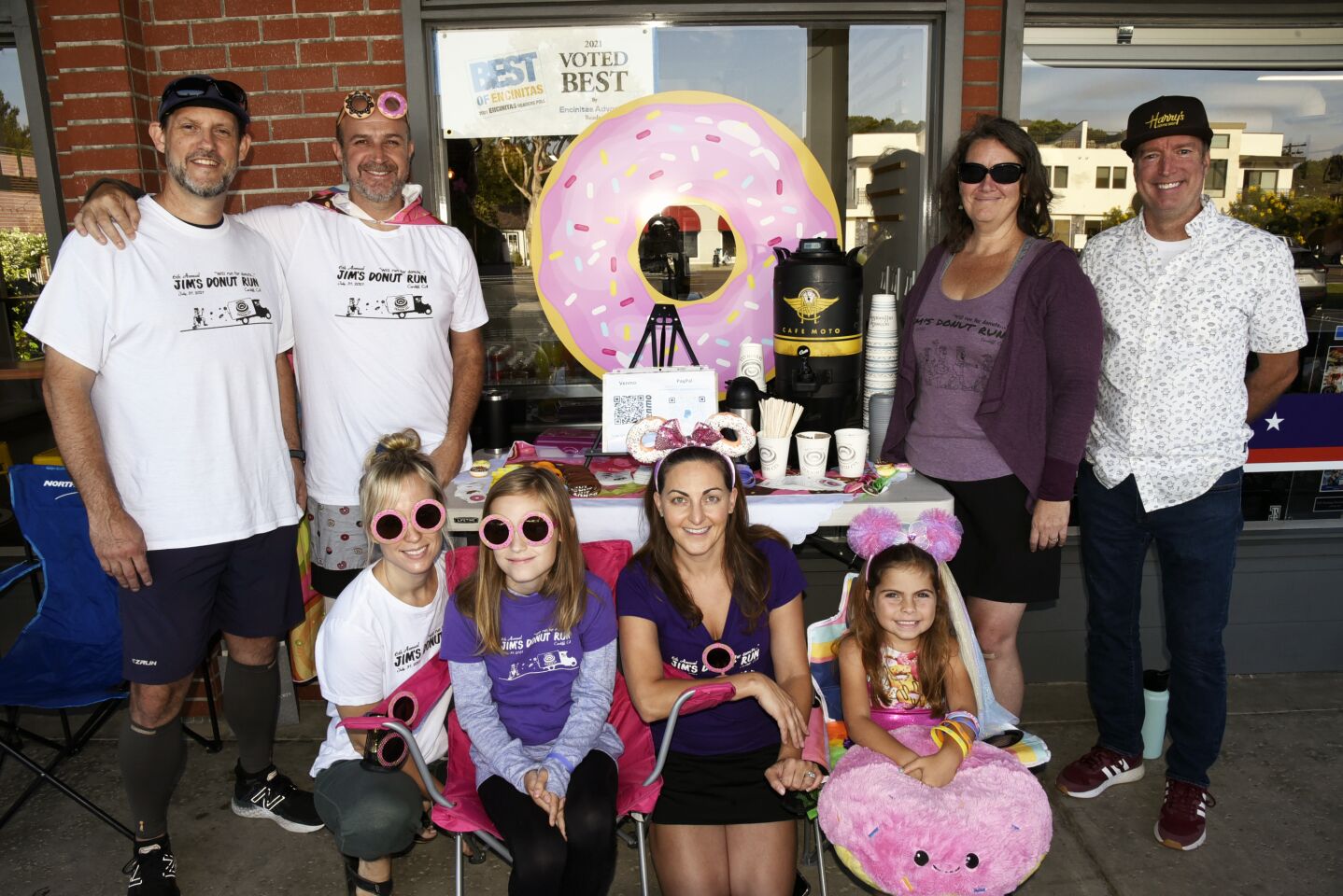Back row: Jim's Donut Run co-founders Jamie Mazza and Jim Isaac, co-founders Paula Mazza and Carl Ogden. Front row: Kristin Evans, Cassidy, Rose Weinstein, Sky. Jim's company (CSC), matched employee contributions and money raised, and proceeds will go to Rancho Coastal Humane Society