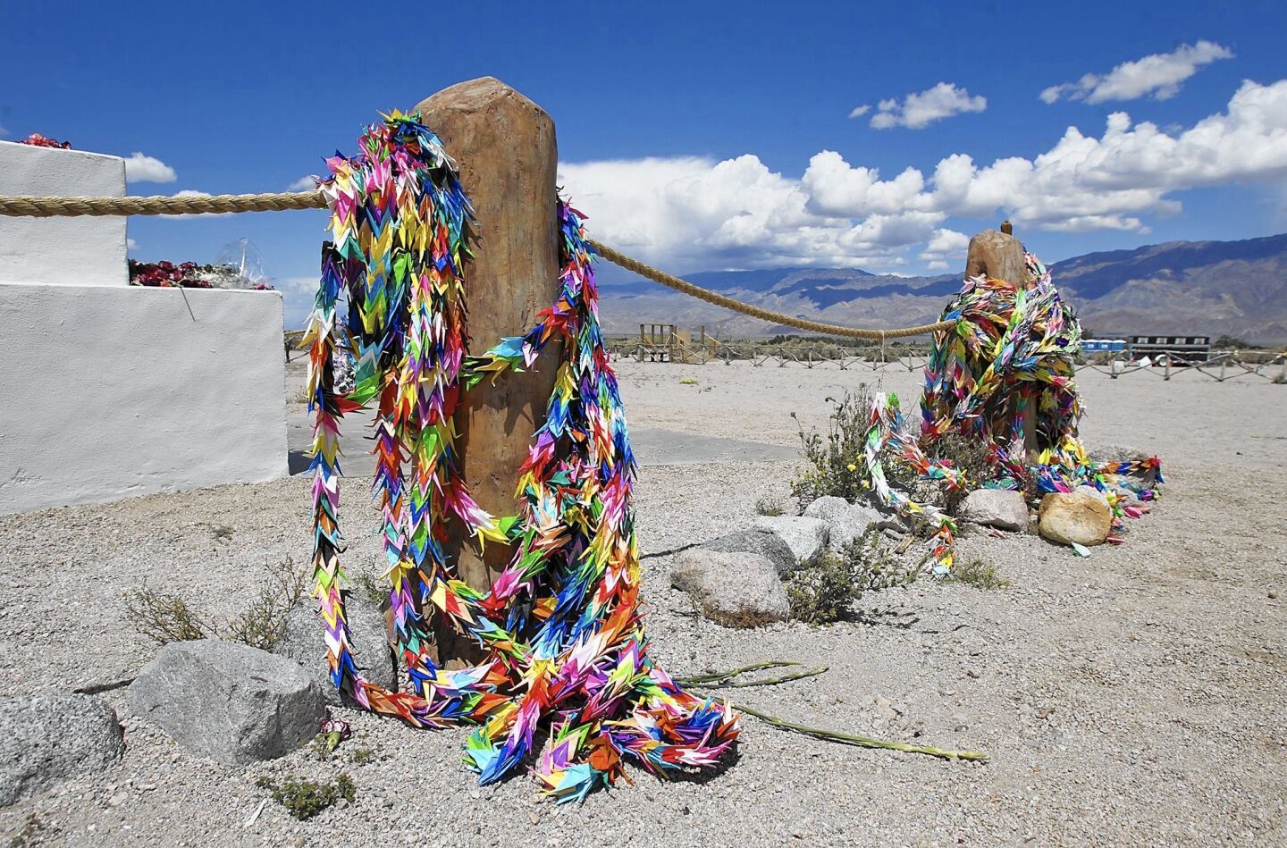 Colorful Japanese origami are laid around the cemetery monument, or "soul consoling tower," days after the 47th annual pilgrimage at the Manzanar Historical WWII Internment Camp.