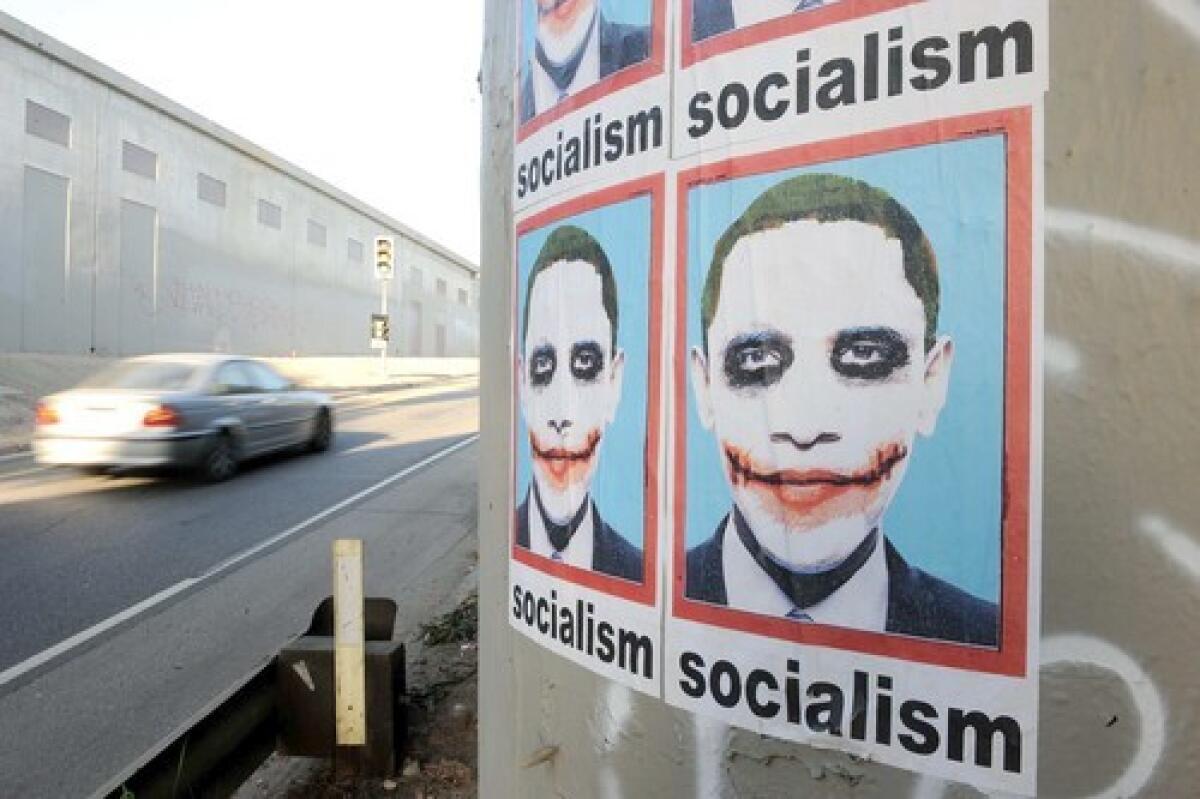 SIGHTING: A poster portraying President Barack Obama as the Joker from the Batman movie "The Dark Knight" is visible along an L.A. freeway.