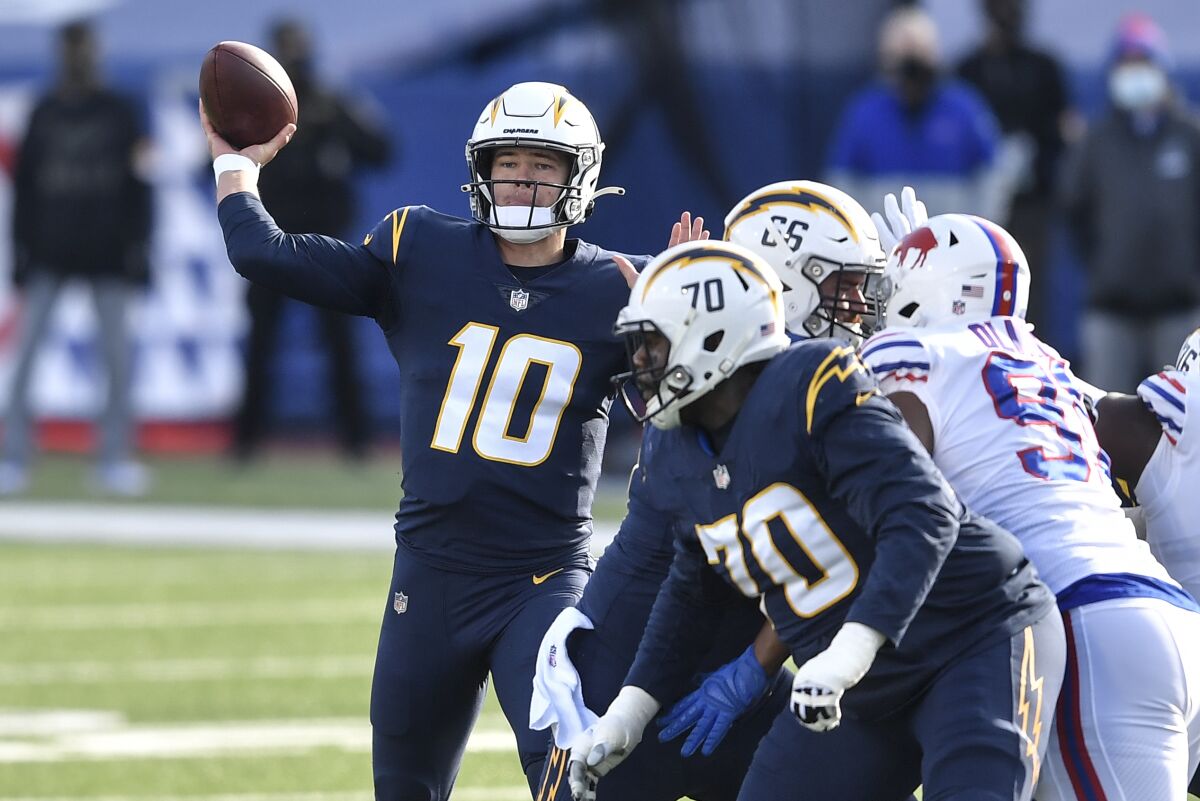 Los Angeles Chargers quarterback Justin Herbert passes during the first half of an NFL football game against the Buffalo Bills, Sunday, Nov. 29, 2020, in Orchard Park, N.Y. (AP Photo/Adrian Kraus)