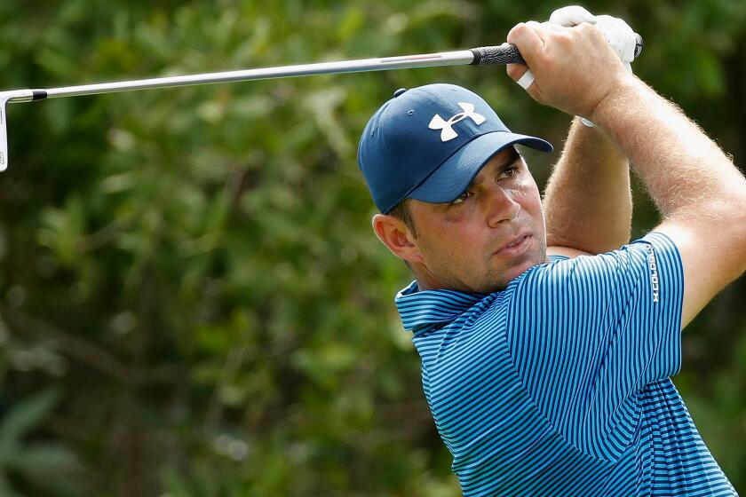 Gary Woodland watches his tee shot at No. 17 during the second roundof the OHL Classic at Mayakoba on Friday.