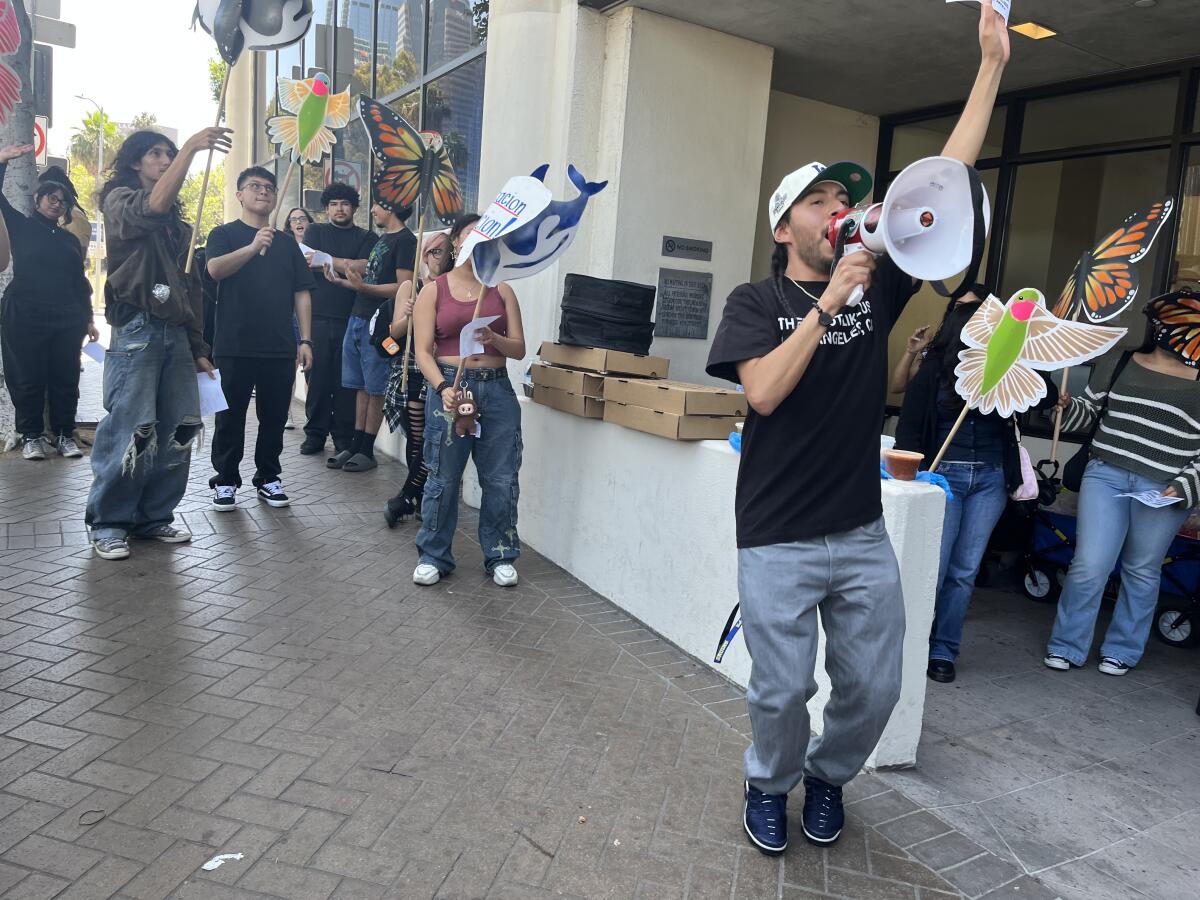 Students and supporters rally with signs and bullhorns.
