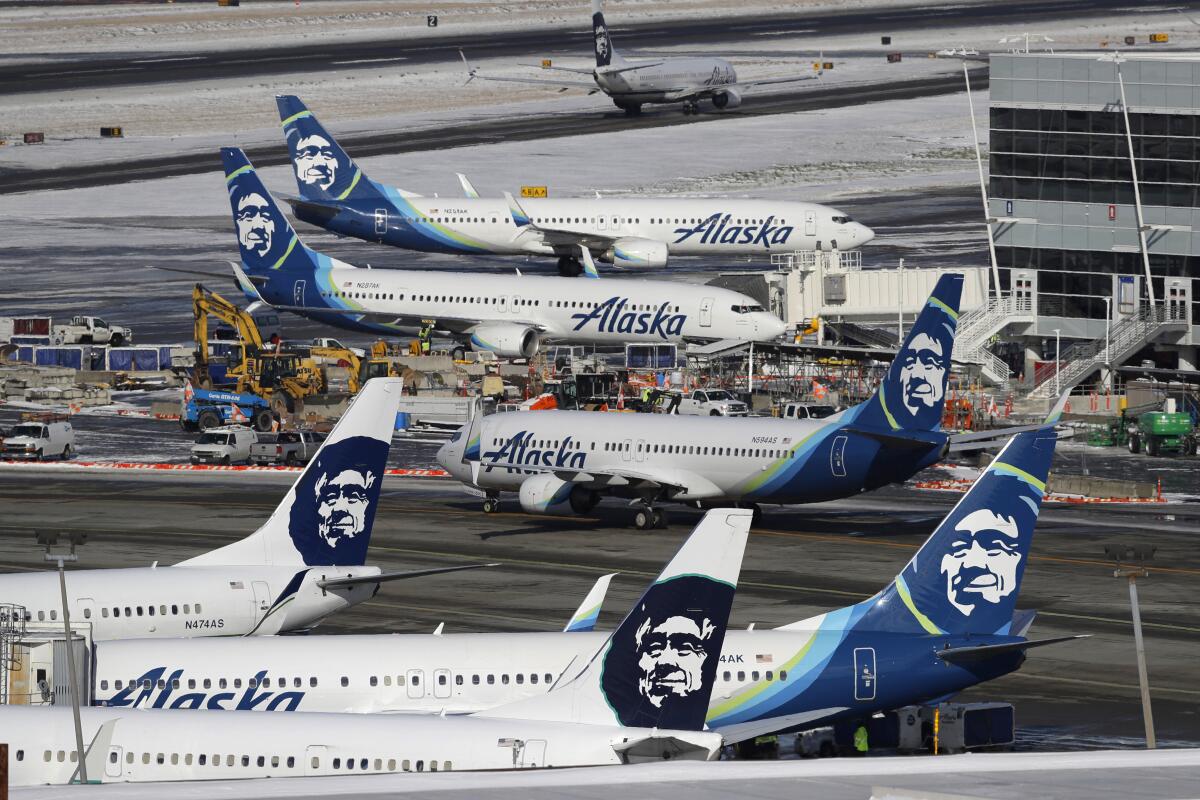 Alaska Airlines planes at an airport.