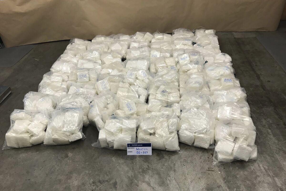 In this undated photo provided by the New Zealand Police, some of the 613 kg. (1,351 lb.) of methamphetamine that it seized sits on display in Auckland, New Zealand. New Zealand police said Wednesday, March 2, 2022, they had seized more than half a ton of methamphetamine at the border and arrested six people in one of the nation's biggest drug busts. (New Zealand Police via AP)