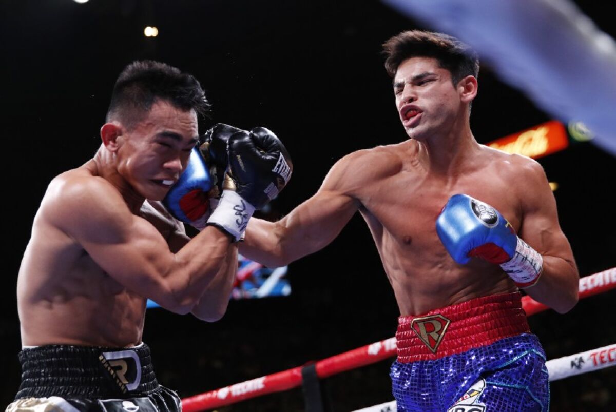 Ryan Garcia, right, punches Romero Duno during their lightweight fight in Las Vegas in November 2019.