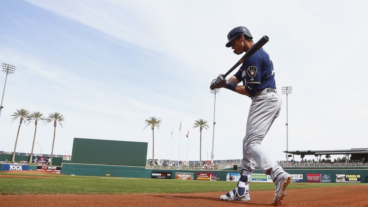 Milwaukee Brewers outfielder Christian Yelich warms up in the on-deck circle during a spring training game against the Cincinnati Reds on Friday, March 16, 2018 in Goodyear, Ariz.