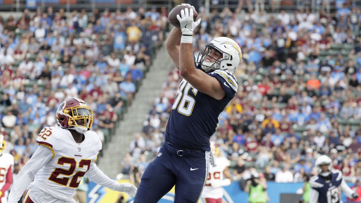 Chargers tight end Hunter Henry hauls in a touchdown pass over Redskins safety Deshazor Everett