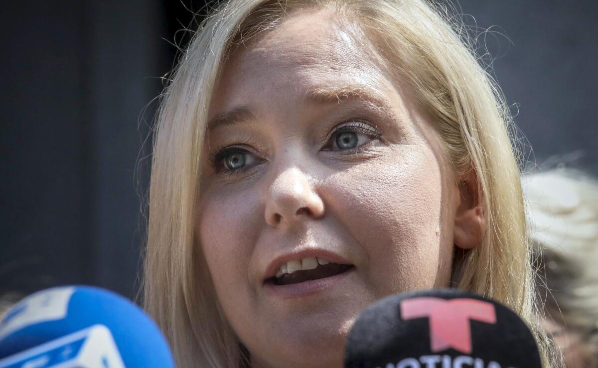 FILE - Virginia Giuffre speaks during a news conference outside a Manhattan court in New York, Aug. 27, 2019. Giuffre, the woman who recently settled a lawsuit in which she had claimed to have been sexually trafficked to Britain's Prince Andrew and others by the financier Jeffrey Epstein, has dropped a similar claim against noted American attorney Alan Dershowitz, saying she may have erred in accusing him. Her lawsuit against the prominent lawyer was withdrawn Tuesday, Nov. 8, 2022, court records in New York show. (AP Photo/Bebeto Matthews, File)