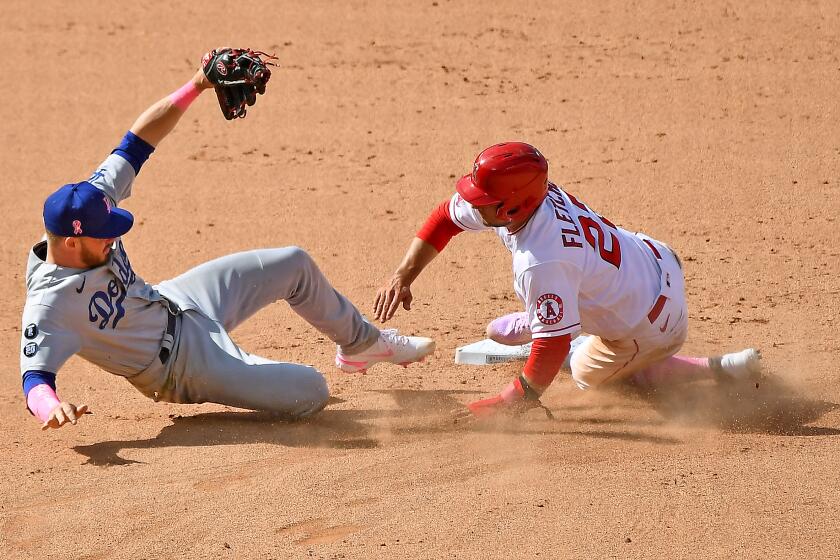 ANAHEIM, CALIFORNIA MAY 9, 2021-Dodgers 2nd baseman Gavin Lux can't catch the relay throw to 2nd base.