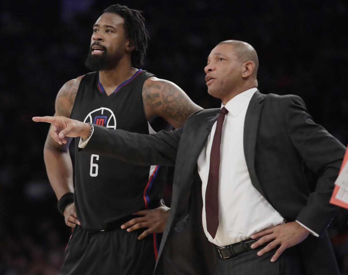 Clippers Coach Doc Rivers speaks to DeAndre Jordan during a game against the New York Knicks on Feb. 8.