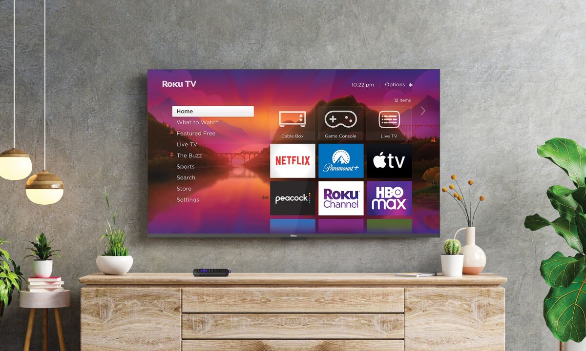 A television bolted to the wall displaying streaming apps.
