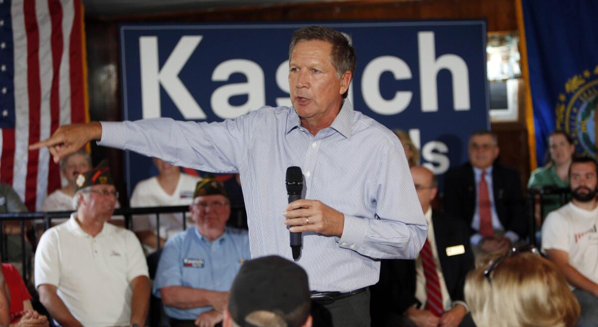 Republican presidential candidate Gov. John Kasich, R-Ohio, speaks to a packed crowd during a campaign stop at the VFW Wednesday, Aug. 12, 2015, in Derry,NH (AP Photo/Jim Cole)