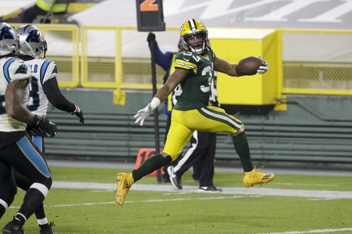 Green Bay's Aaron Jones runs for a touchdown against Carolina on Dec. 19, 2020, in Green Bay, Wis.