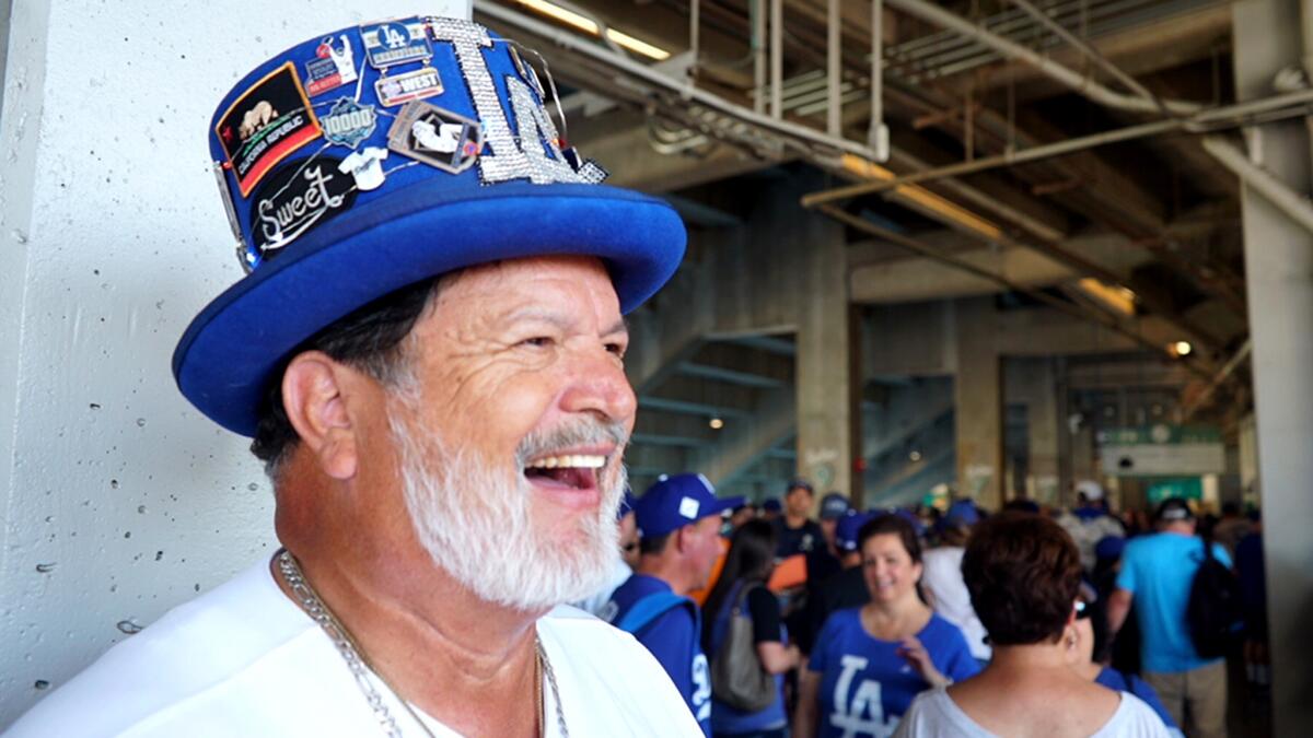 Benjamin Rodriguez sports his Dodger blue top hat before Game 2 of the World Series at Dodger Stadium in 2017.