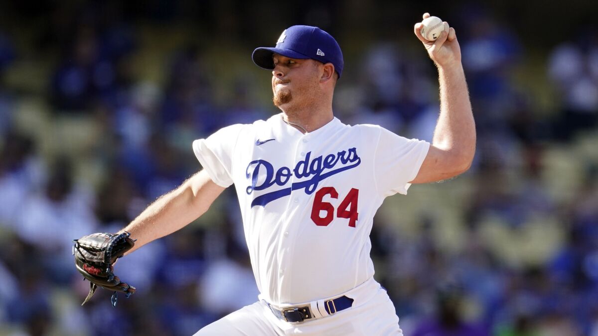 Dodgers relief pitcher Caleb Ferguson delivers against the Colorado Rockies on Oct. 5.