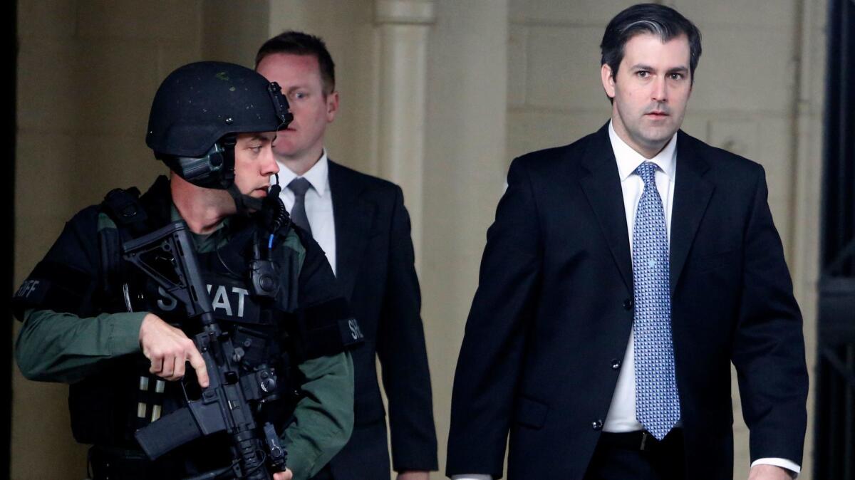 Michael Slager walks from the Charleston County Courthouse under the protection of the Charleston County Sheriff’s Department, after a mistrial was declared for his trial in Charleston, S.C. on Dec. 5.