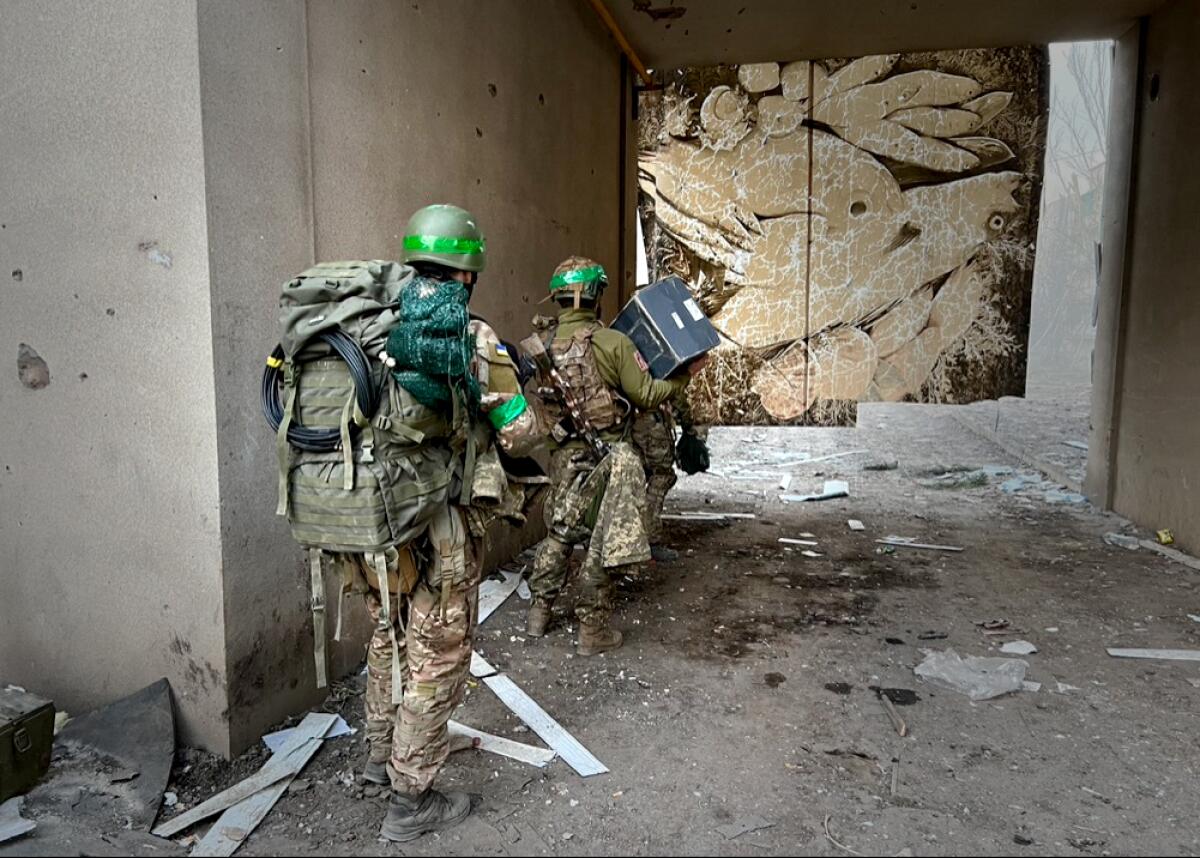 Members of Ukraine's 251st Battalion air reconnaissance unit en route to their position in Bakhmut.