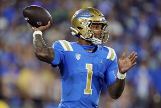 UCLA quarterback Dorian Thompson-Robinson throws a pass against Washington during the first half.