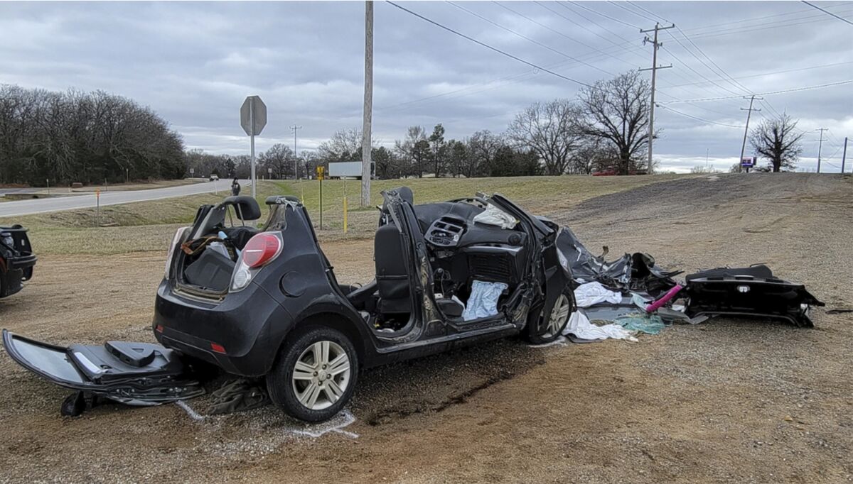 FILE - In this image provided by KFOR-TV, a heavily damaged vehicle is seen off a road in Tishomingo, Okla., following a two-vehicle collision in which six teenage students were killed, Tuesday, March 22, 2022. A preliminary report says the teen driver of a small car that collided with a large truck in Oklahoma had cannabis in her system, according to toxicology tests conducted after her death. The driver and five passengers all died in the collision. All six teens were students at Tishomingo High School in Oklahoma. (NewsNation KFOR via AP File)