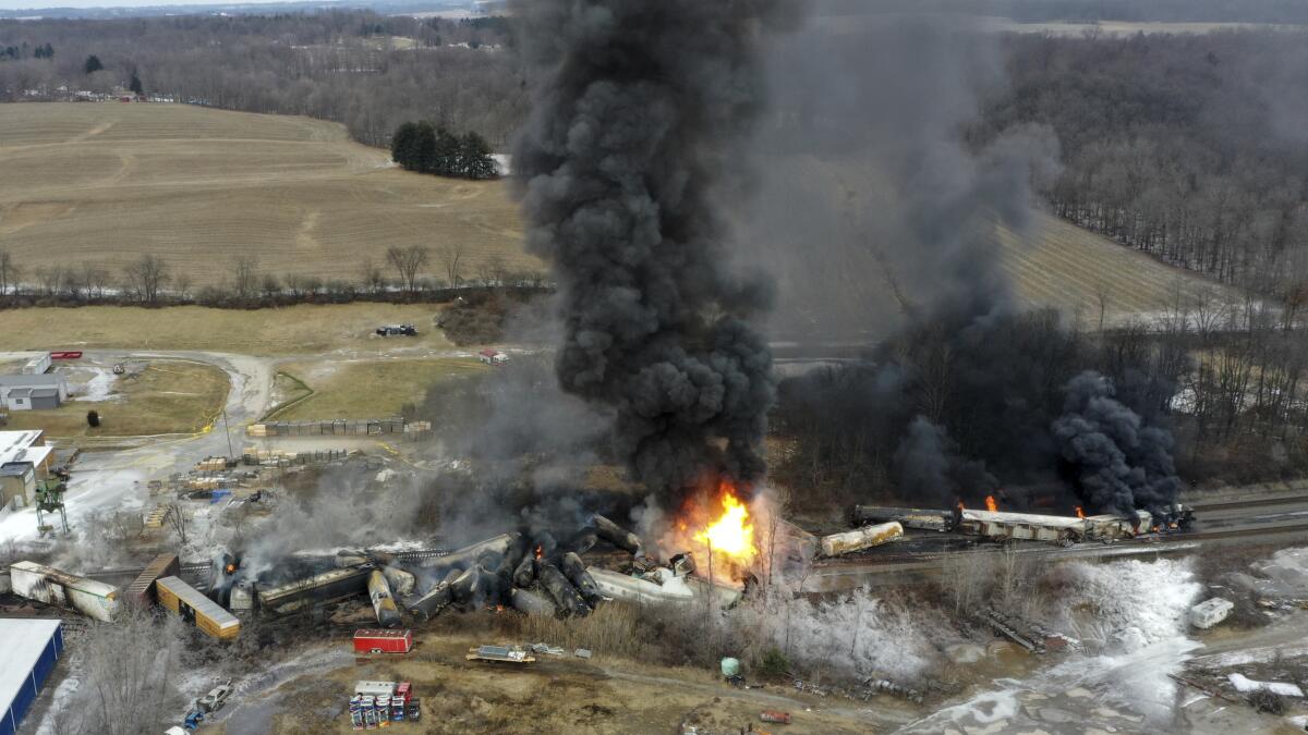 This photo taken with a drone shows portions of a Norfolk and Southern freight train that derailed in East Palestine, Ohio
