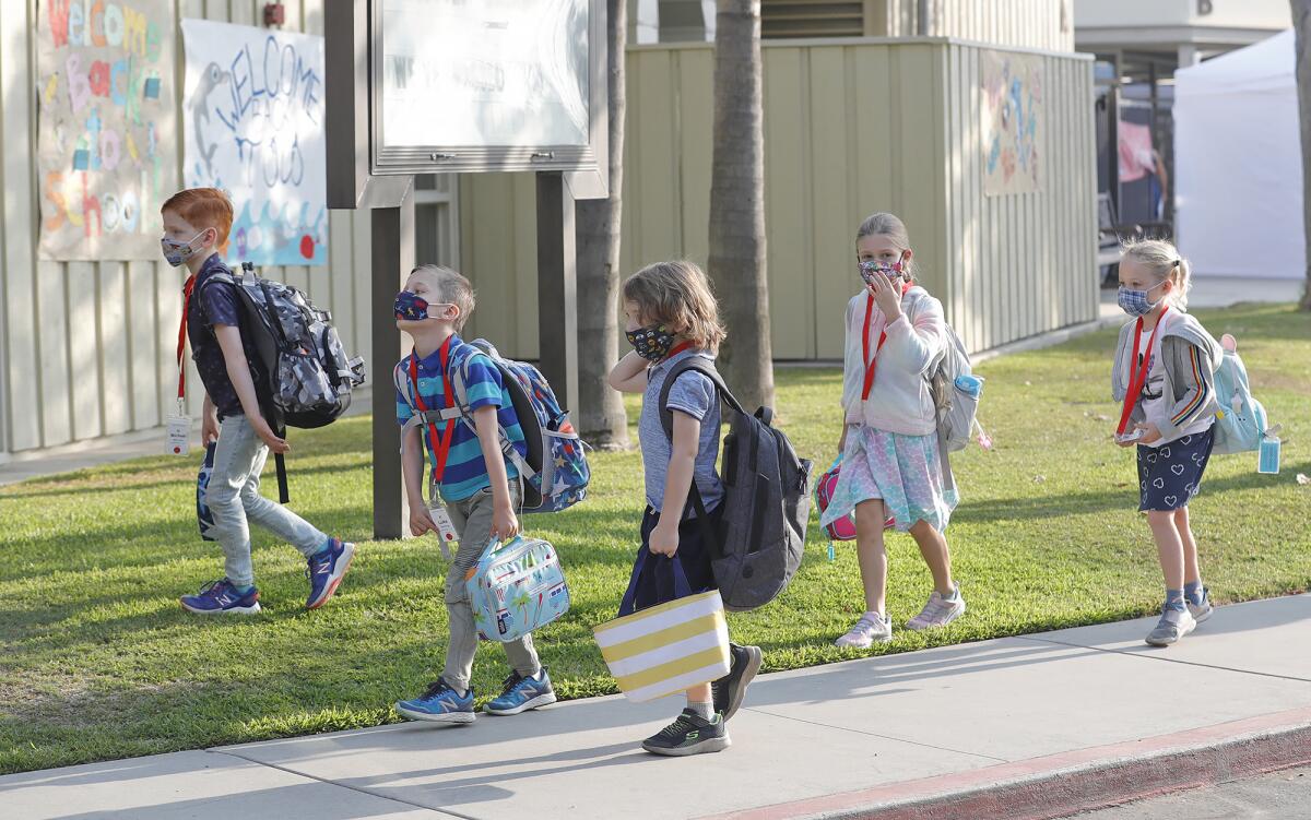 Kindergartners arrive for the first day of in-person learning at Top of the World Elementary School in Laguna Beach.
